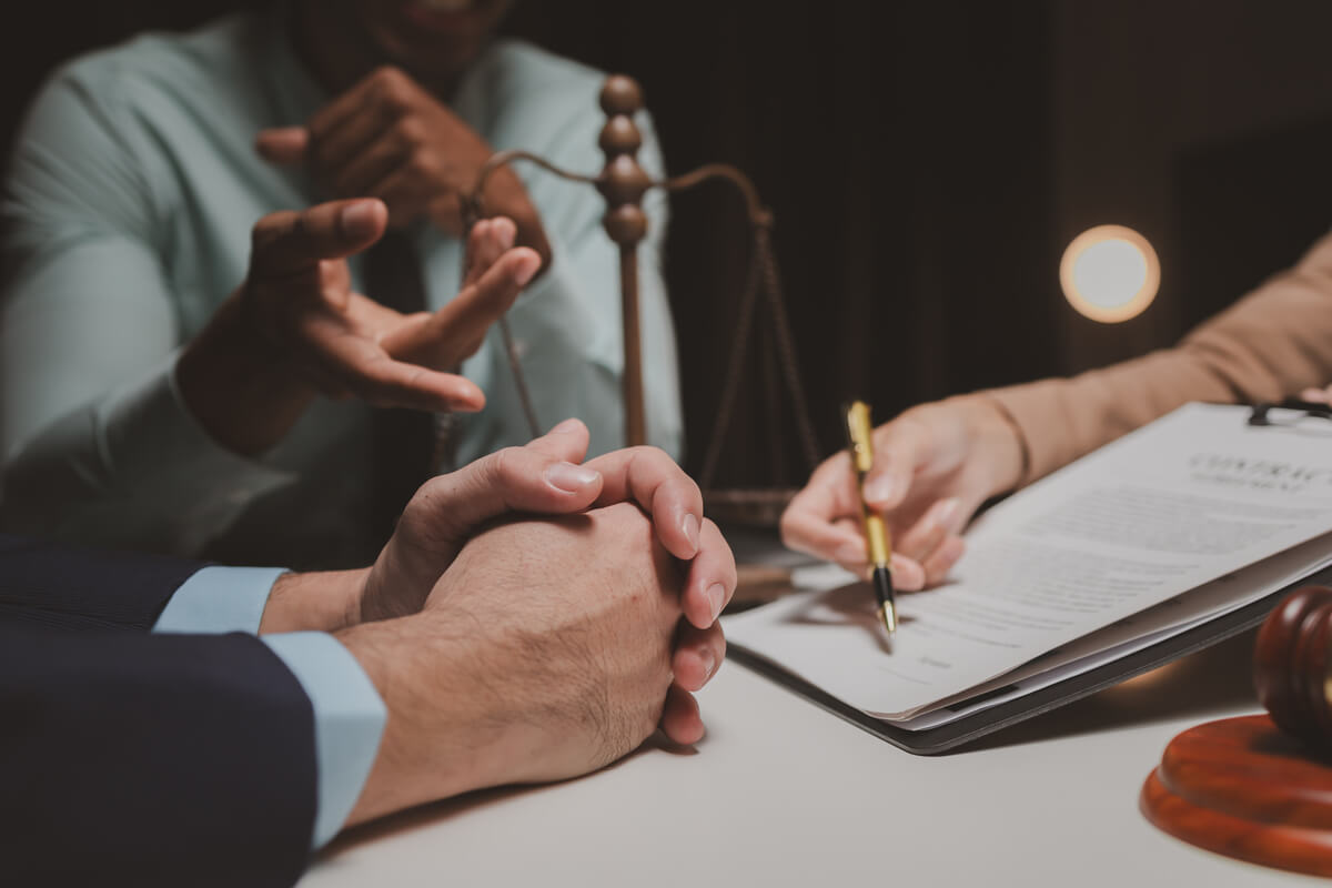 a-group-of-lawyers-is-discussing-contract-document-QJVQ5X6.jpg a-group-of-lawyers-is-discussing-contract-document-QJVQ5X6.jpg
